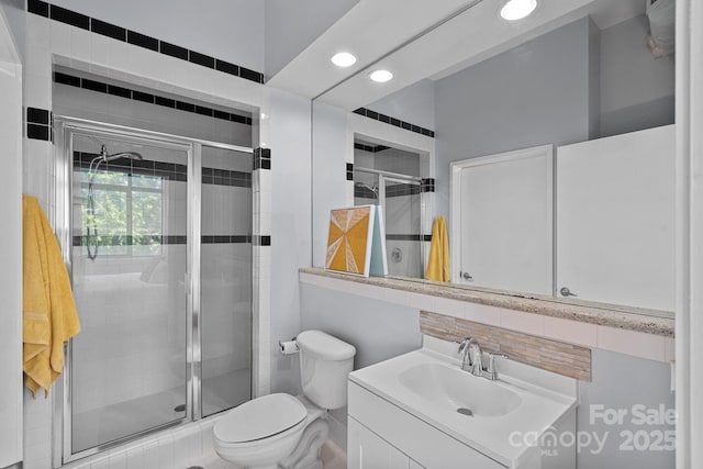 514 W 10th St Unit 302, Charlotte, NC 28202 - bathroom with recessed lighting, vanity, a shower stall, and backsplash