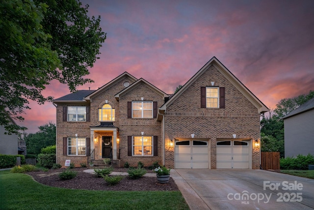1807 Robbins Meadows Dr, Waxhaw, NC 28173 - view of front of property featuring brick siding, driveway, and an attached garage