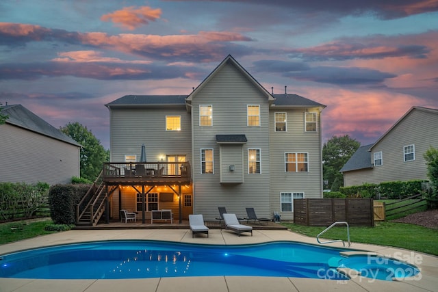 1807 Robbins Meadows Dr, Waxhaw, NC 28173 - back of house at dusk featuring stairs, a deck, and a patio