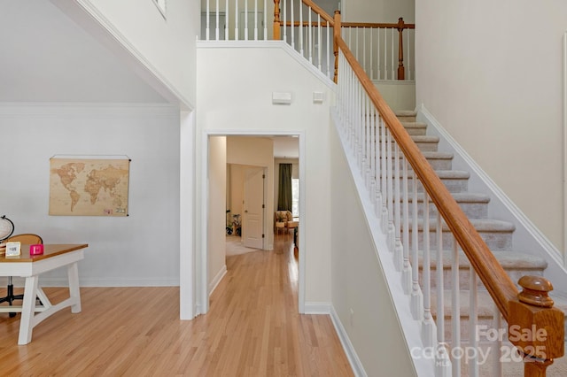 1807 Robbins Meadows Dr, Waxhaw, NC 28173 - stairs with wood finished floors and a high ceiling