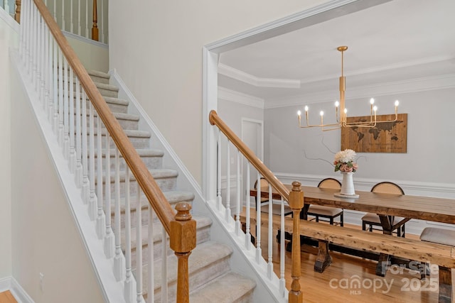 1807 Robbins Meadows Dr, Waxhaw, NC 28173 - staircase with ornamental molding, a chandelier, and wood finished floors