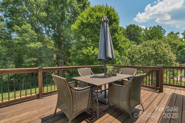 1807 Robbins Meadows Dr, Waxhaw, NC 28173 - wooden deck featuring outdoor dining space and view of wooded area