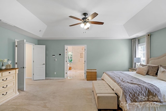 1807 Robbins Meadows Dr, Waxhaw, NC 28173 - bedroom with a tray ceiling, light carpet, ceiling fan, and ensuite bathroom