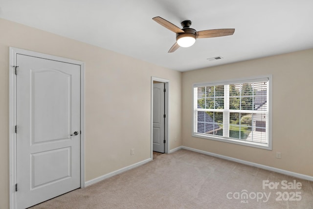 1807 Robbins Meadows Dr, Waxhaw, NC 28173 - unfurnished bedroom featuring light carpet and ceiling fan