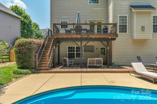 1807 Robbins Meadows Dr, Waxhaw, NC 28173 - rear view of property featuring a wooden deck, a patio, and an outdoor pool