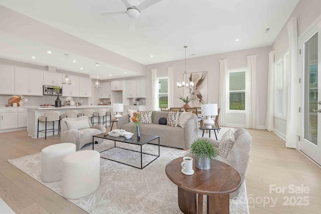 1074 Wylie Falls Ln, York, SC 29745 - living room featuring light wood-style flooring, a chandelier, recessed lighting, and a ceiling fan