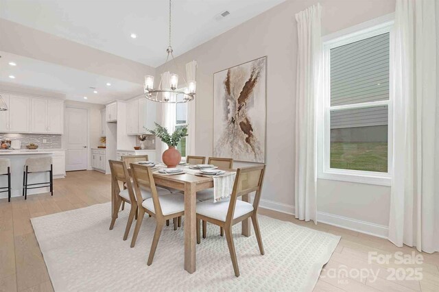 1074 Wylie Falls Ln, York, SC 29745 - dining space featuring a chandelier, recessed lighting, and light wood-type flooring