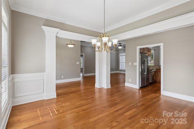 2411 Stoney Run Dr Unit 13, Oakboro, NC 28129 - empty room with crown molding, a chandelier, and wood finished floors
