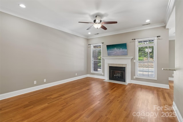 2411 Stoney Run Dr Unit 13, Oakboro, NC 28129 - unfurnished living room with ceiling fan, light wood-style flooring, a fireplace, ornamental molding, and recessed lighting
