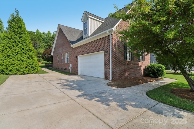2411 Stoney Run Dr Unit 13, Oakboro, NC 28129 - view of side of property featuring driveway, brick siding, an attached garage, roof with shingles, and a lawn