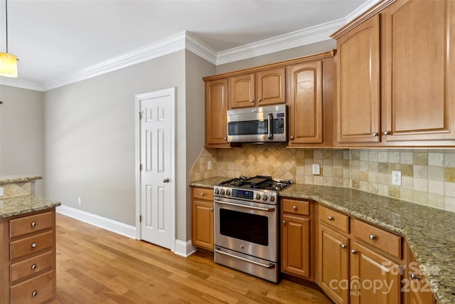 2411 Stoney Run Dr Unit 13, Oakboro, NC 28129 - kitchen featuring stainless steel appliances, ornamental molding, light wood-style floors, light stone counters, and decorative backsplash