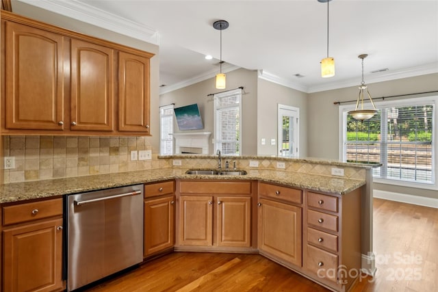 2411 Stoney Run Dr Unit 13, Oakboro, NC 28129 - kitchen featuring stainless steel dishwasher, light wood-type flooring, a peninsula, light stone countertops, and crown molding