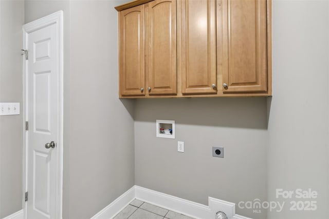 2411 Stoney Run Dr Unit 13, Oakboro, NC 28129 - washroom with hookup for an electric dryer, cabinet space, hookup for a washing machine, and tile patterned flooring