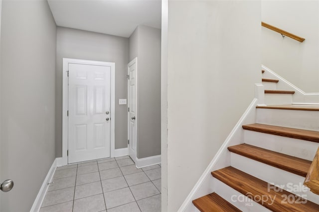 2411 Stoney Run Dr Unit 13, Oakboro, NC 28129 - entryway featuring light tile patterned floors and stairway
