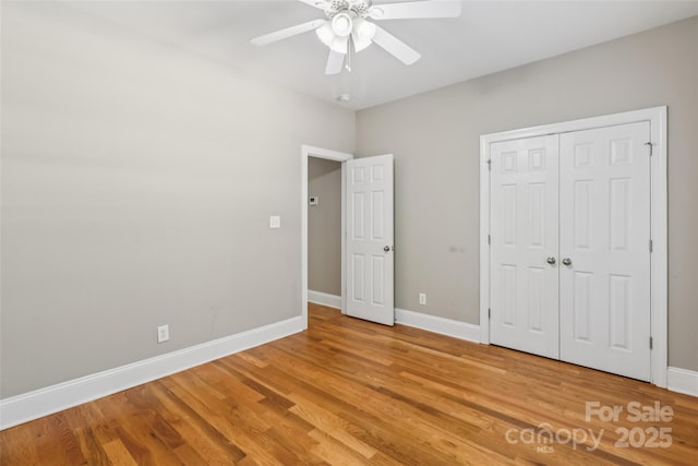 2411 Stoney Run Dr Unit 13, Oakboro, NC 28129 - unfurnished bedroom with light wood-type flooring, a ceiling fan, and a closet