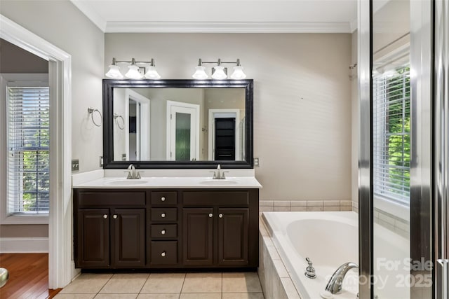 2411 Stoney Run Dr Unit 13, Oakboro, NC 28129 - full bath with double vanity, a bath, crown molding, and tile patterned flooring