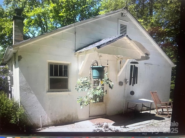 10 Old Fort Rd, Fairview, NC 28730 - back of property with a chimney and a patio area
