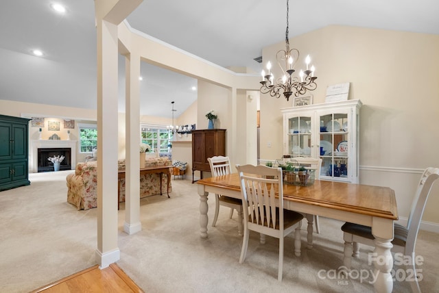 50 Grove End Rd, Fletcher, NC 28732 - dining space with a chandelier, lofted ceiling, light colored carpet, a fireplace, and recessed lighting