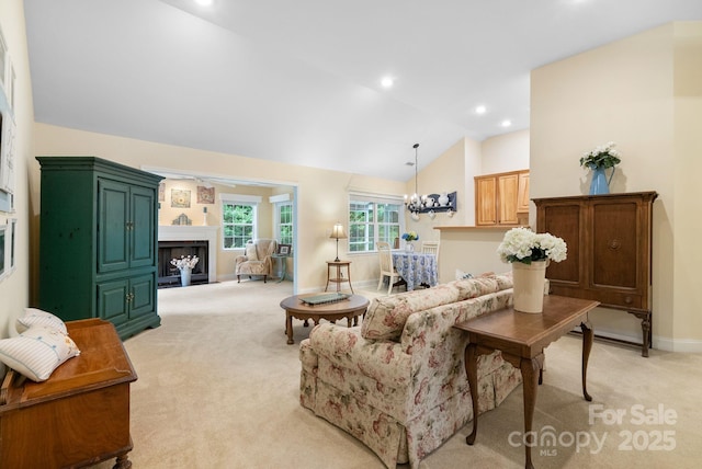 50 Grove End Rd, Fletcher, NC 28732 - living area with light colored carpet, a fireplace, vaulted ceiling, a chandelier, and recessed lighting