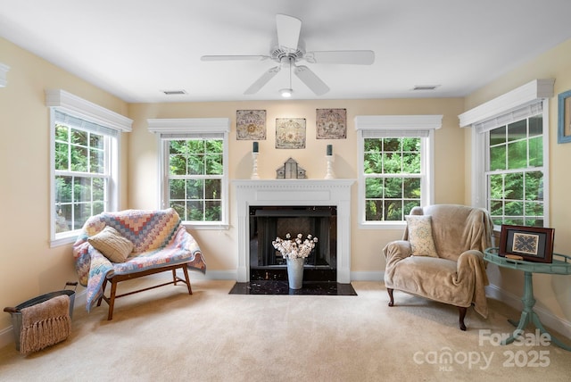 50 Grove End Rd, Fletcher, NC 28732 - living area with healthy amount of natural light, a fireplace with flush hearth, carpet flooring, and a ceiling fan