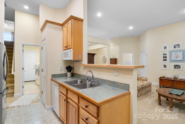 50 Grove End Rd, Fletcher, NC 28732 - kitchen featuring white appliances, washer / clothes dryer, and recessed lighting