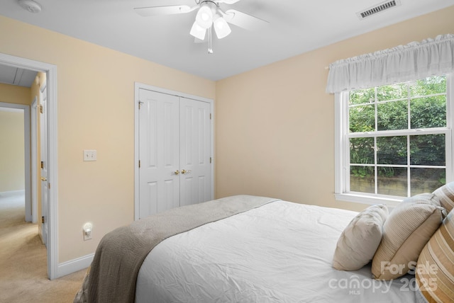 50 Grove End Rd, Fletcher, NC 28732 - bedroom featuring light colored carpet, attic access, a closet, and a ceiling fan