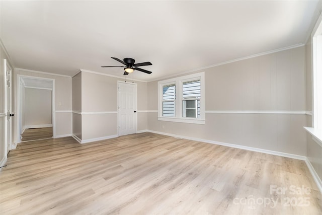 105 Mcgill Ave NW, Concord, NC 28025 - spare room featuring a ceiling fan, light wood-style floors, and crown molding