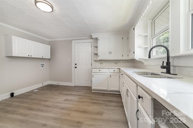 105 Mcgill Ave NW, Concord, NC 28025 - kitchen with open shelves, white cabinets, ornamental molding, decorative backsplash, and light stone counters