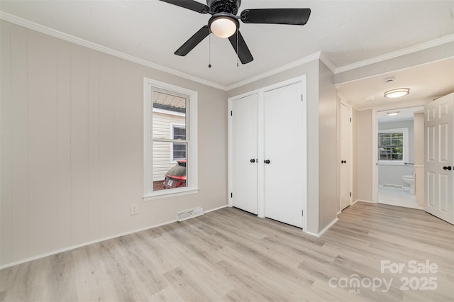 105 Mcgill Ave NW, Concord, NC 28025 - unfurnished bedroom featuring light wood-style flooring, crown molding, and ceiling fan