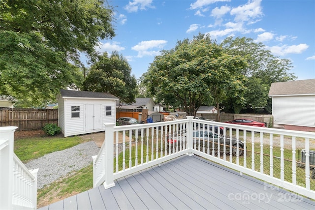 105 Mcgill Ave NW, Concord, NC 28025 - wooden deck featuring a storage unit, a fenced backyard, and a residential view
