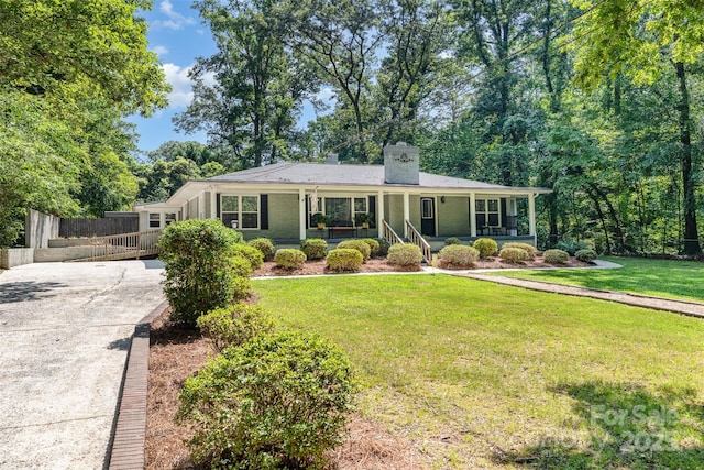 304 W Colonial Dr, Salisbury, NC 28144 - single story home with concrete driveway, covered porch, and a chimney