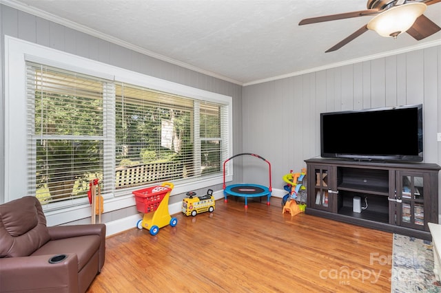 304 W Colonial Dr, Salisbury, NC 28144 - playroom with crown molding, wood finished floors, and ceiling fan