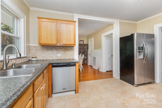 304 W Colonial Dr, Salisbury, NC 28144 - kitchen with stainless steel appliances, crown molding, dark countertops, backsplash, and light tile patterned flooring