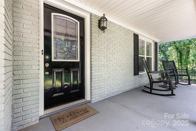 304 W Colonial Dr, Salisbury, NC 28144 - doorway to property with covered porch and brick siding