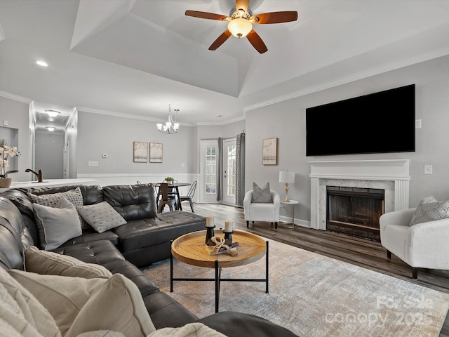 409 Danielle Way, Fort Mill, SC 29715 - living area featuring crown molding, ceiling fan, a premium fireplace, a chandelier, and wood finished floors