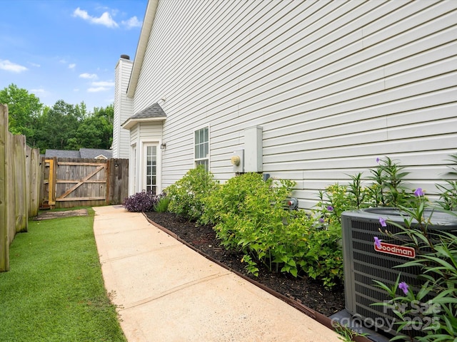 409 Danielle Way, Fort Mill, SC 29715 - view of exterior entry featuring a gate and a chimney