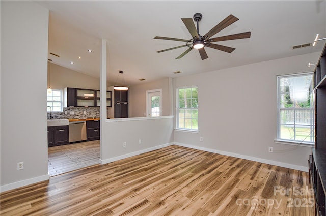 1312 Shenandoah Cir, Rock Hill, SC 29730 - unfurnished living room featuring light wood finished floors, lofted ceiling, and a ceiling fan
