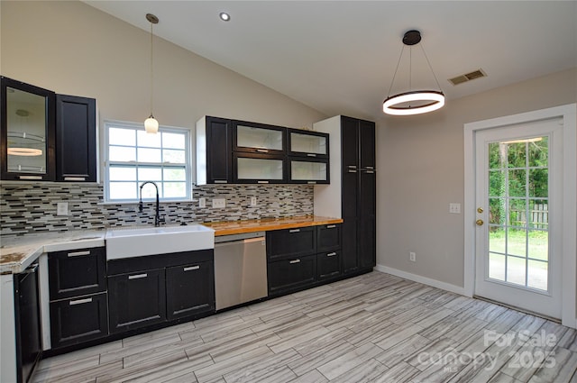1312 Shenandoah Cir, Rock Hill, SC 29730 - kitchen featuring stainless steel dishwasher, dark cabinets, backsplash, light wood-style flooring, and lofted ceiling