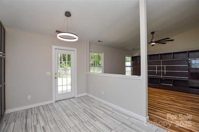 1312 Shenandoah Cir, Rock Hill, SC 29730 - unfurnished living room featuring healthy amount of natural light, a ceiling fan, wood finished floors, and vaulted ceiling