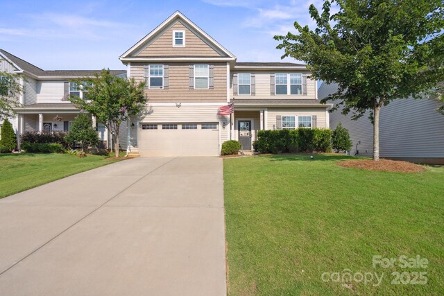 212 Fesperman Cir, Troutman, NC 28166 - view of front of house featuring driveway, a garage, and a front yard