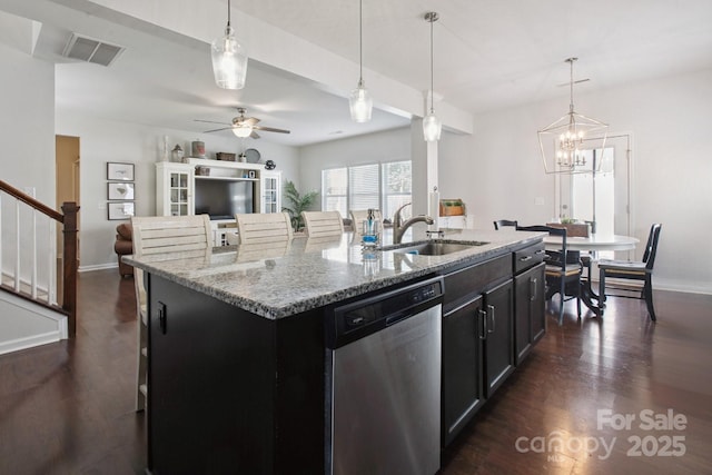 212 Fesperman Cir, Troutman, NC 28166 - kitchen with stainless steel dishwasher, dark wood-style flooring, and a center island with sink