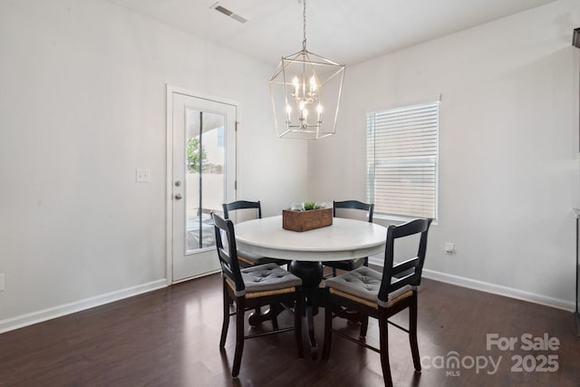 212 Fesperman Cir, Troutman, NC 28166 - dining area with dark wood-style floors and a chandelier