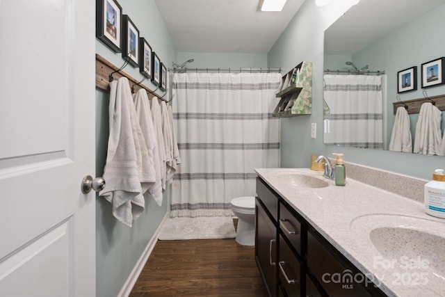 212 Fesperman Cir, Troutman, NC 28166 - bathroom featuring double vanity, wood finished floors, and curtained shower