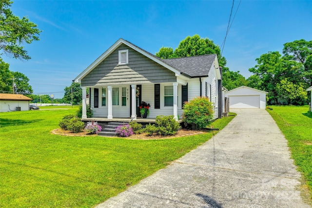 903 Rhode Island Ave, Kannapolis, NC 28083 - view of front facade with an outbuilding, a porch, a front lawn, and a detached garage