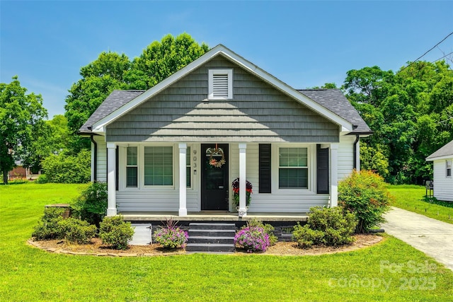 903 Rhode Island Ave, Kannapolis, NC 28083 - bungalow-style house featuring covered porch, a front yard, and a shingled roof