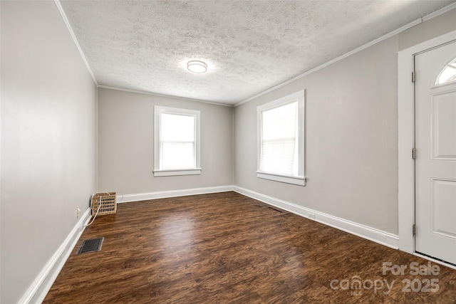 903 Rhode Island Ave, Kannapolis, NC 28083 - empty room with dark wood finished floors, a textured ceiling, and ornamental molding