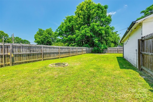 903 Rhode Island Ave, Kannapolis, NC 28083 - fenced backyard featuring an outdoor fire pit