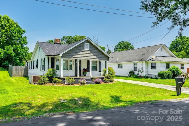 903 Rhode Island Ave, Kannapolis, NC 28083 - view of front facade featuring a porch, a chimney, and a shingled roof