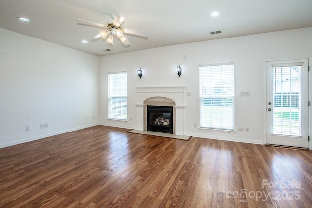 198 Devon Forest Dr, Mooresville, NC 28115 - unfurnished living room featuring wood finished floors, a fireplace, a ceiling fan, and recessed lighting