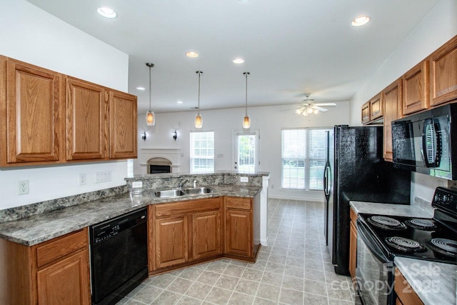 198 Devon Forest Dr, Mooresville, NC 28115 - kitchen featuring black appliances, brown cabinets, and recessed lighting